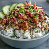 Bang Bang Ground Turkey Rice Bowls are drizzled with creamy chili mayo sauce and topped with sesame seeds and scallions.